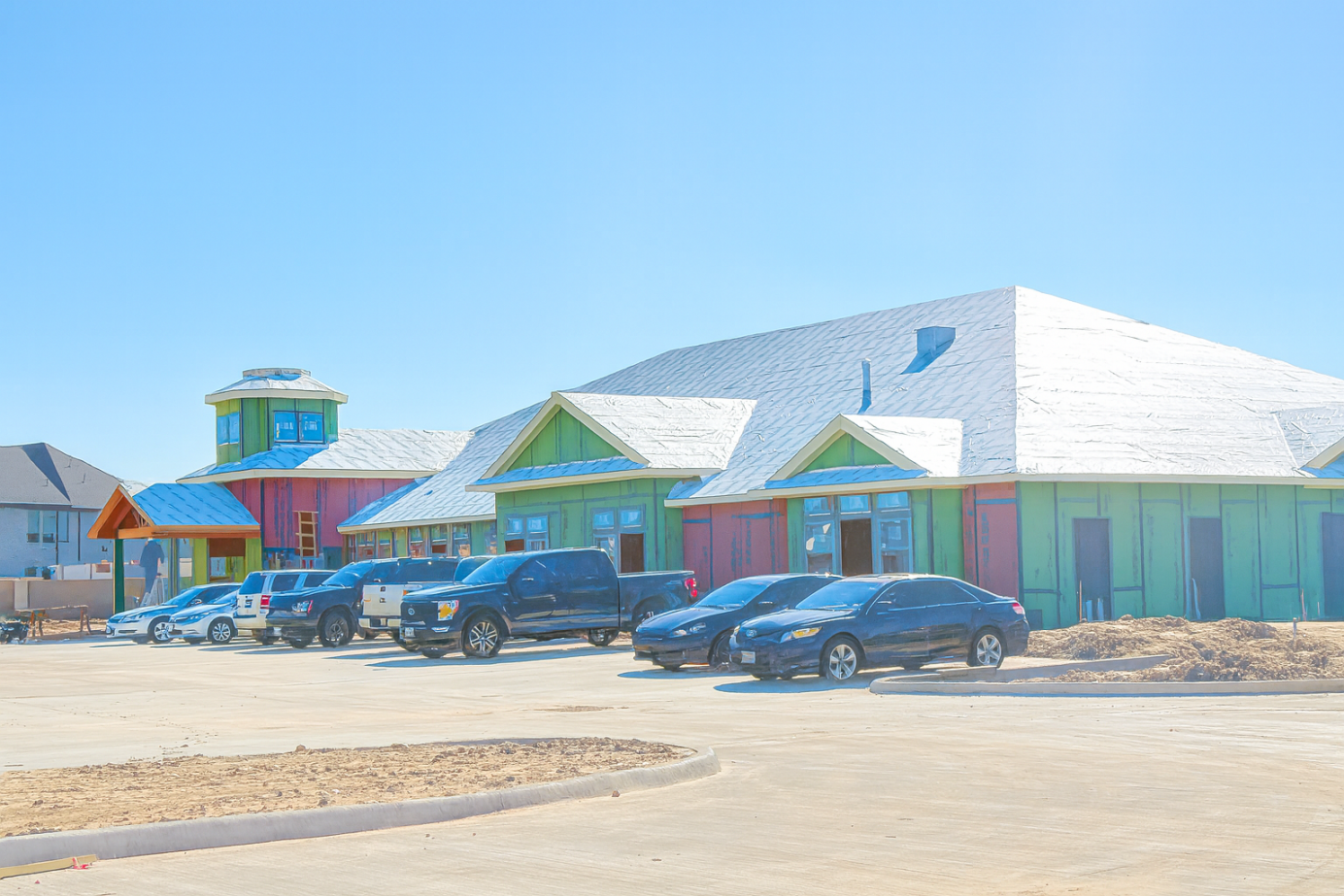 The front elevation is really taking shape, the roofing, framing, and exterior structure are coming together beautifully.